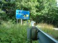 Hunter reaches Kentucky (ya gotta love the shotgun marks on the sign).JPG